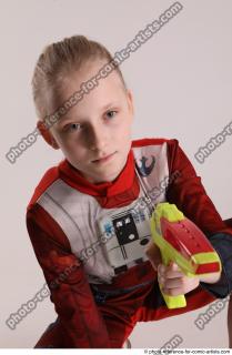 DENISA SITTING POSE WITH GUN